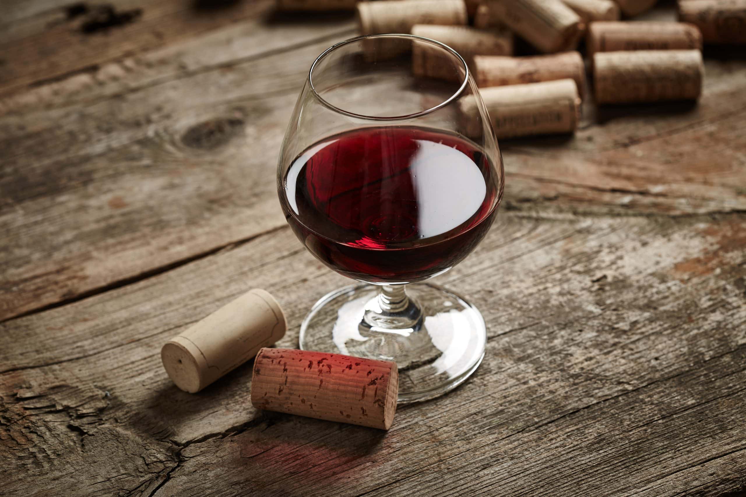 Vintage,Wine,Still,Life,With,Corks,And,Grape,On,Wooden